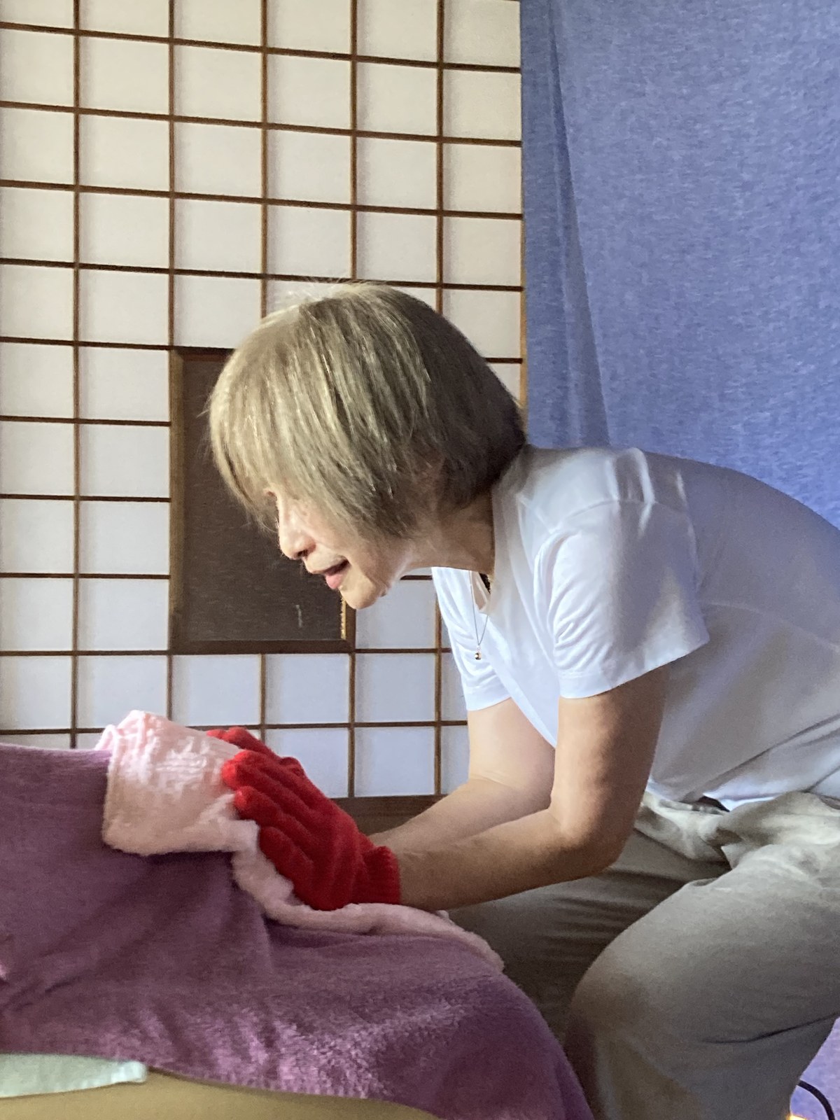 Hands working through a steamed towel