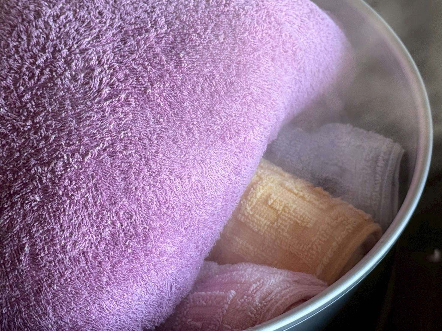 Towels steaming in the pot